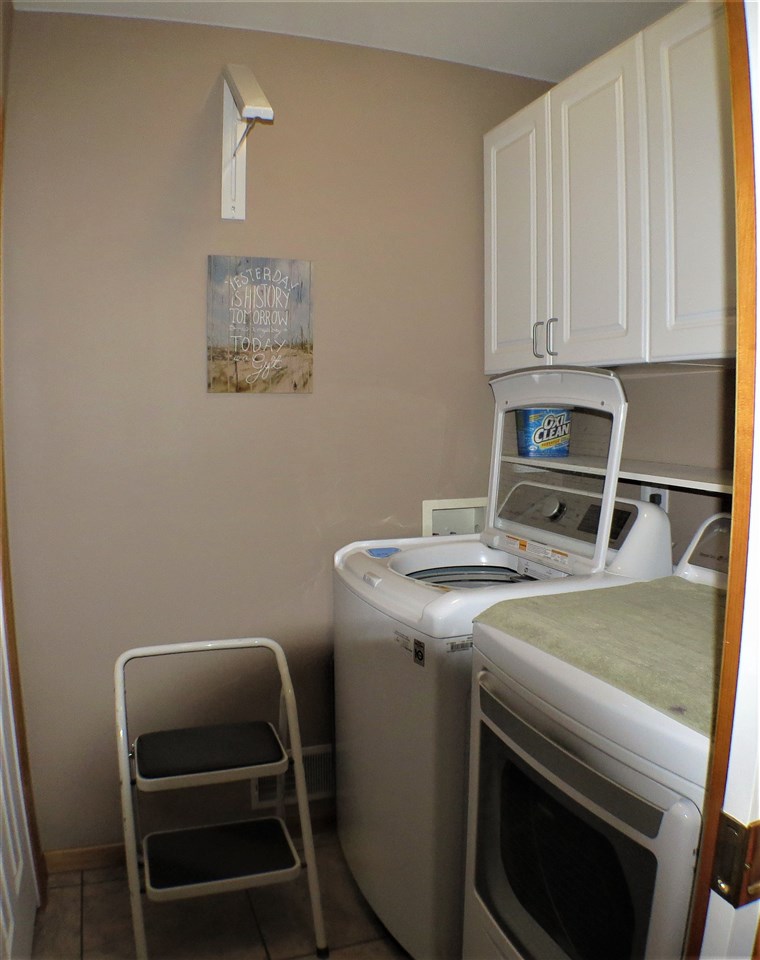 Has a handy rack mounted on the wall to hang your clothes as you take them from the dryer.