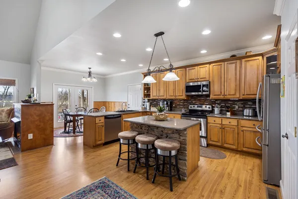 a kitchen with lots of counter top space and refrigerator