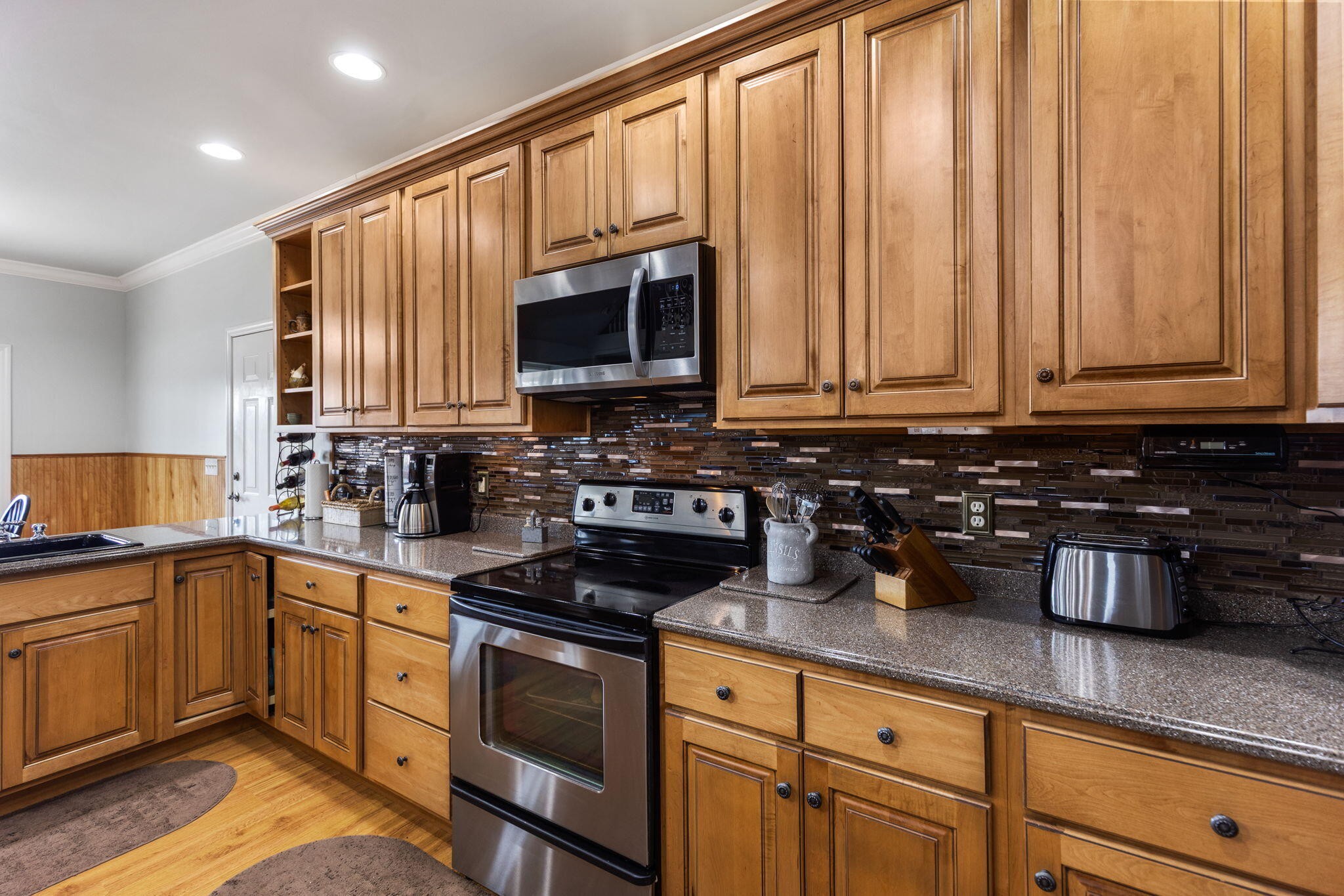 759 Pinhook Road Calhoun, TN 37309 - Photo 13 of 55 a kitchen with stainless steel appliances granite countertop a sink a stove and cabinets
