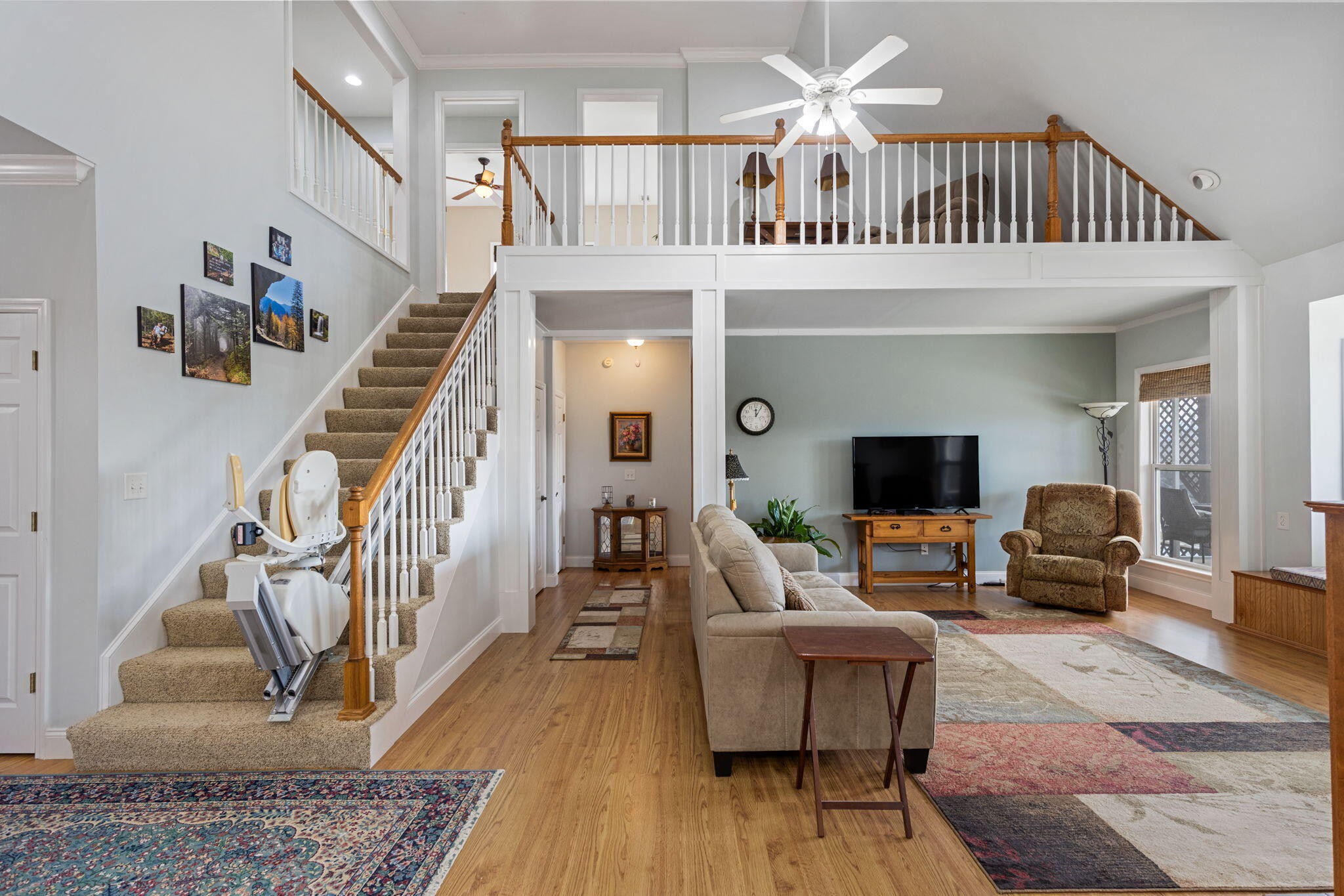 759 Pinhook Road Calhoun, TN 37309 - Photo 17 of 55 a living room with furniture a rug and a chandelier
