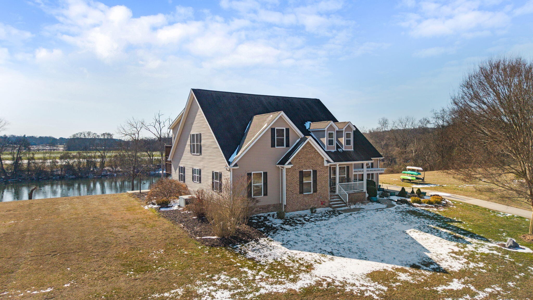 759 Pinhook Road Calhoun, TN 37309 - Photo 2 of 55 a front view of a house with a yard and lake view