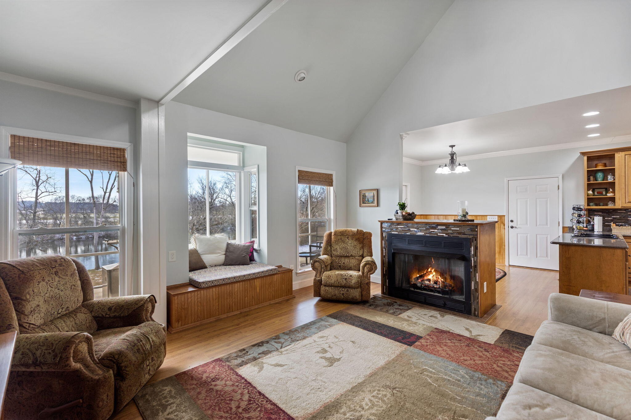 759 Pinhook Road Calhoun, TN 37309 - Photo 21 of 55 a living room with furniture a large window and a fireplace
