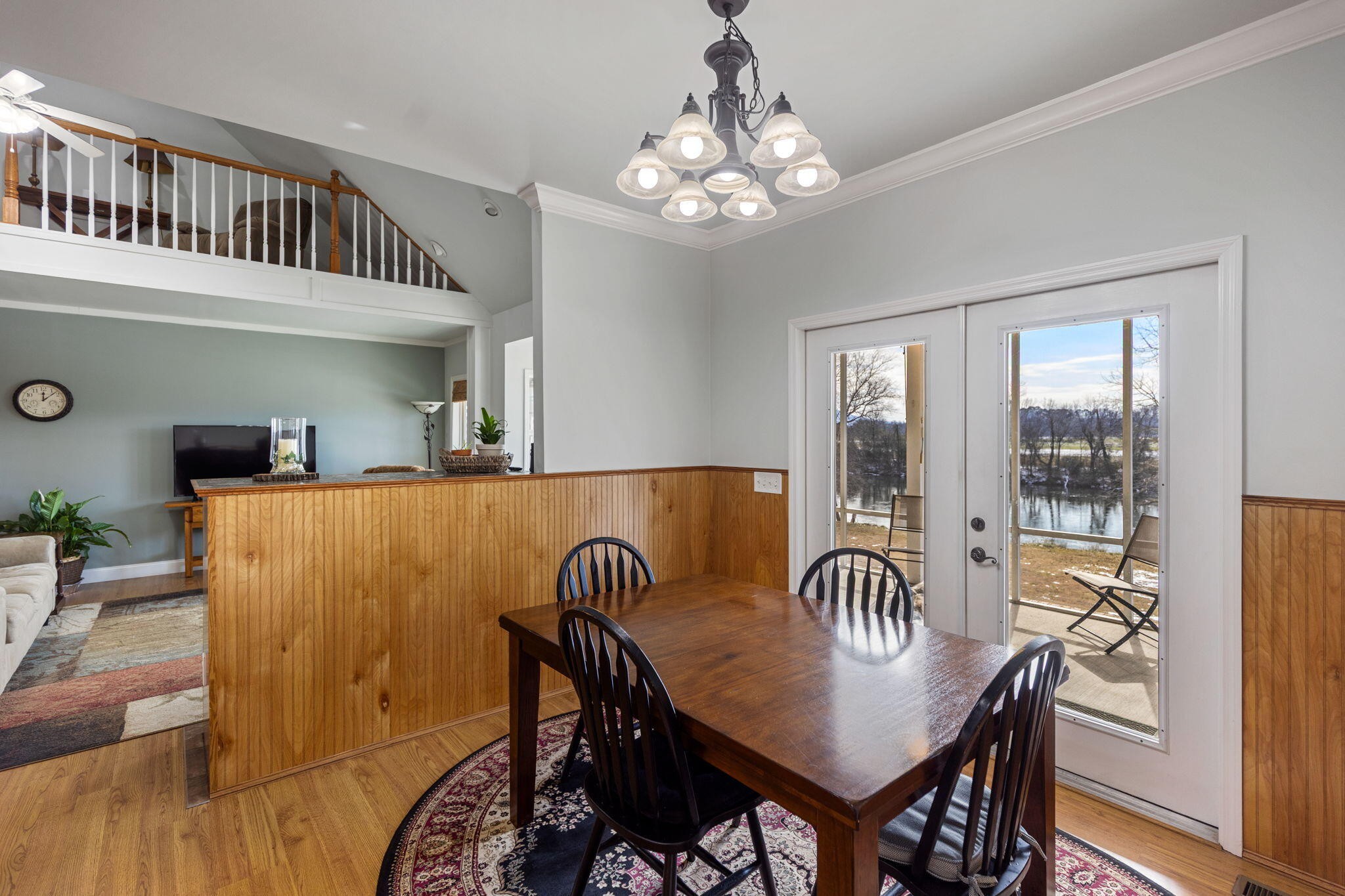 759 Pinhook Road Calhoun, TN 37309 - Photo 22 of 55 a dining room with furniture a chandelier and wooden floor
