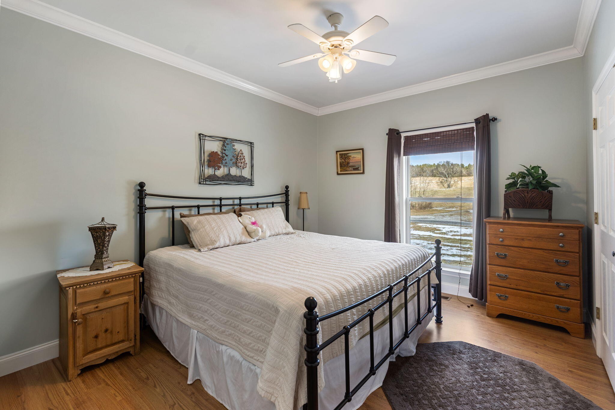 759 Pinhook Road Calhoun, TN 37309 - Photo 23 of 55 a bedroom with a bed and a chandelier