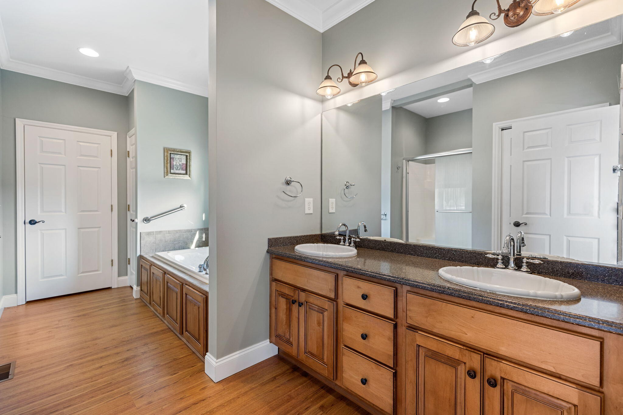 759 Pinhook Road Calhoun, TN 37309 - Photo 28 of 55 a spacious bathroom with a granite countertop double vanity sink a mirror and a shower