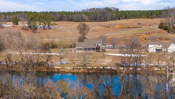 a view of a lake with houses with outdoor space
