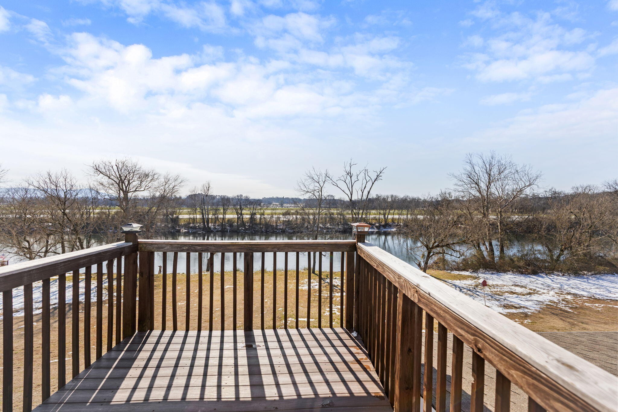 759 Pinhook Road Calhoun, TN 37309 - Photo 43 of 55 a view of a balcony with wooden floor and city view