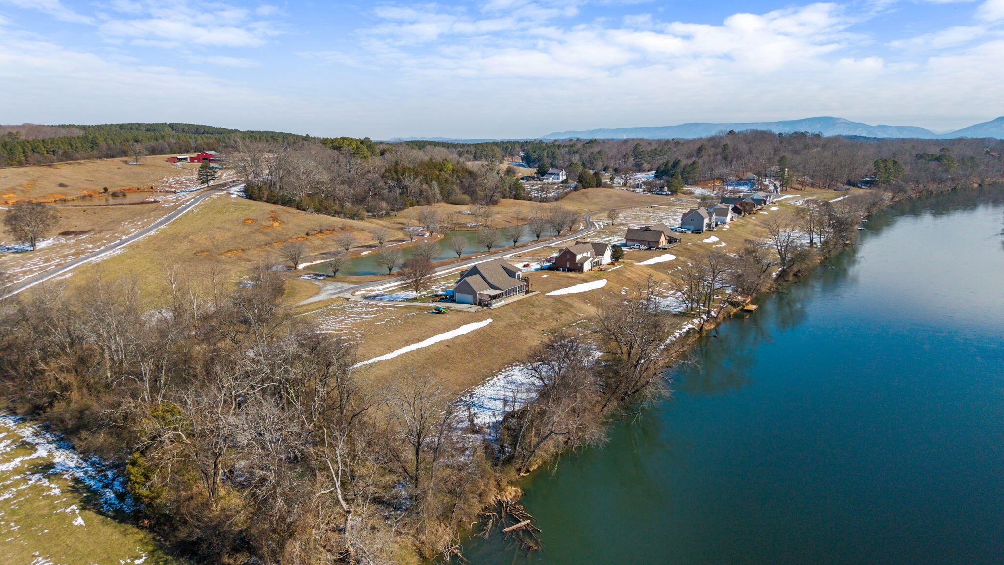 759 Pinhook Road Calhoun, TN 37309 - Photo 51 of 55 a view of a lake with mountains in the background
