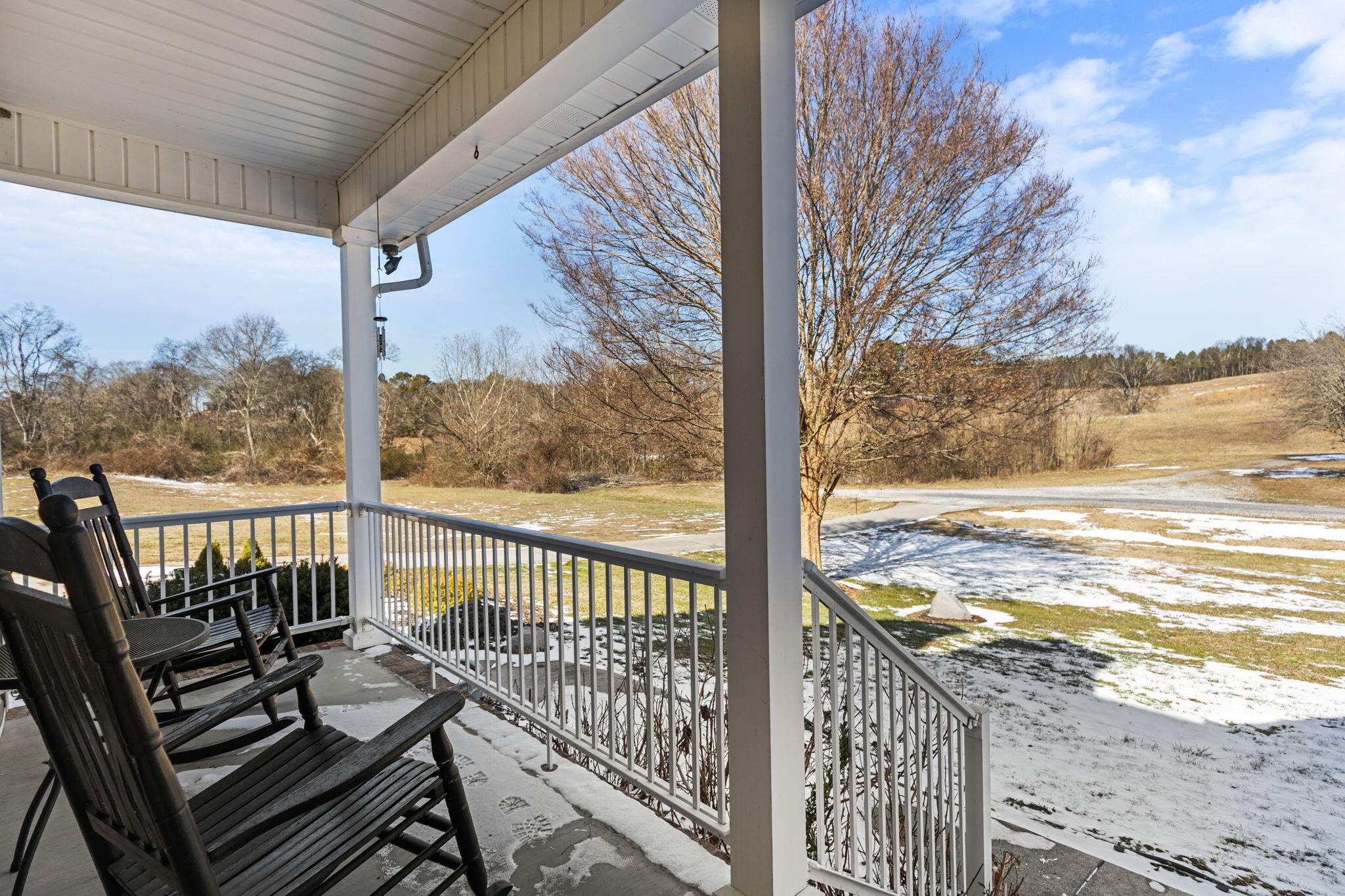 759 Pinhook Road Calhoun, TN 37309 - Photo 7 of 55 a view of a balcony with wooden floor next to a yard