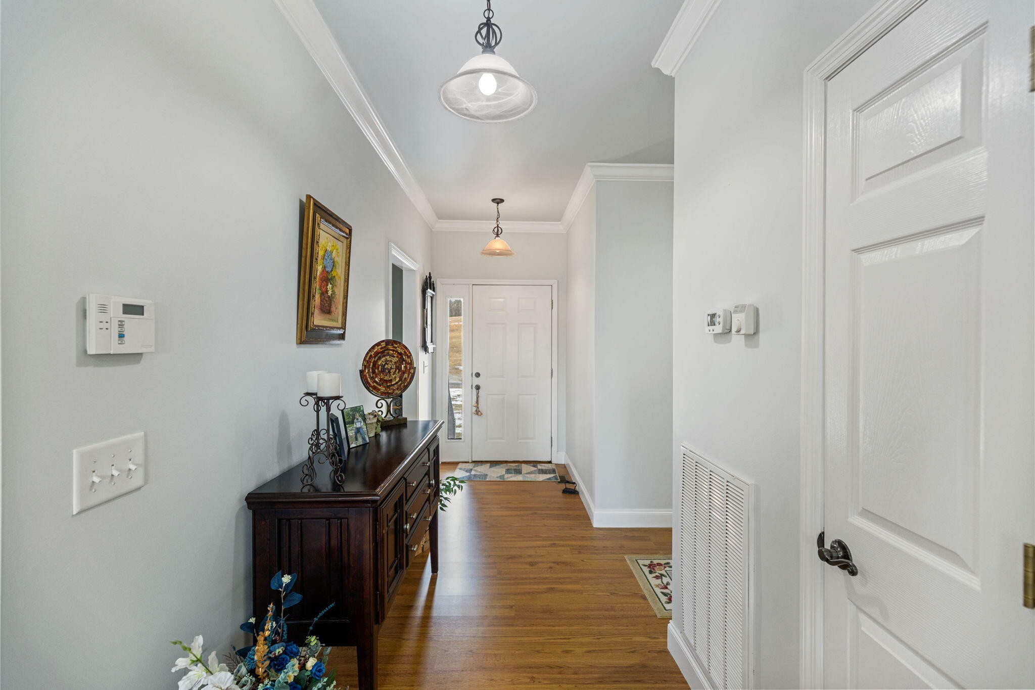 759 Pinhook Road Calhoun, TN 37309 - Photo 9 of 55 a view of a hallway with paintings on the wall