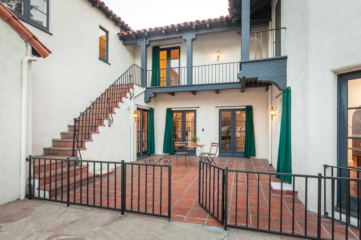 700 South Orange Grove Boulevard Pasadena, CA 91105 - Photo 12 of 50 a view of a house with wooden fence