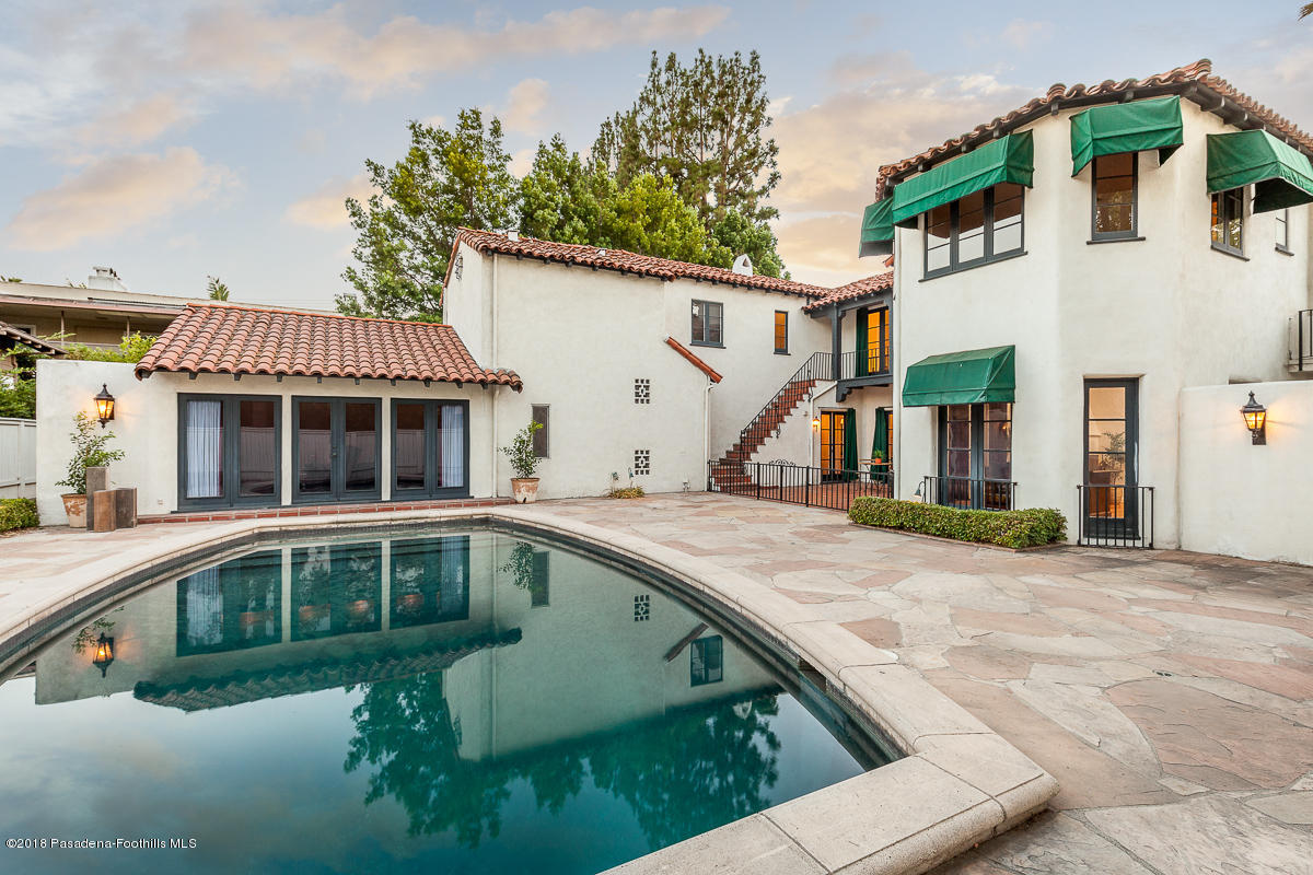 700 South Orange Grove Boulevard Pasadena, CA 91105 - Photo 14 of 50 a view of a house with a swimming pool