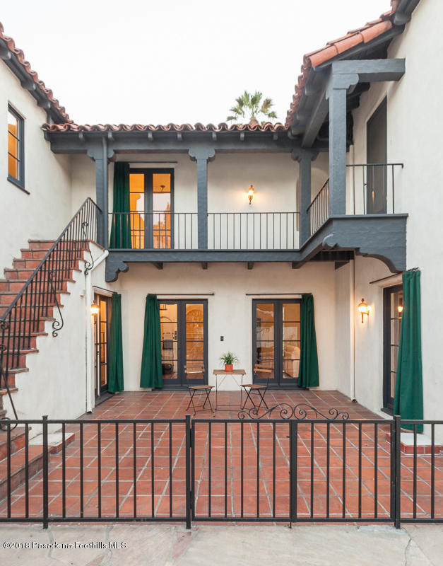 700 South Orange Grove Boulevard Pasadena, CA 91105 - Photo 15 of 50 a view of a brick house with large windows