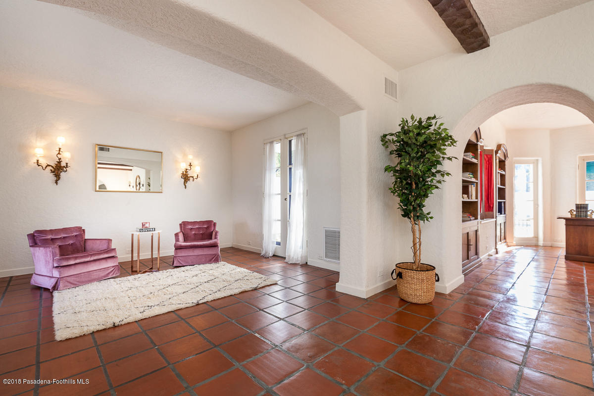 700 South Orange Grove Boulevard Pasadena, CA 91105 - Photo 17 of 50 a living room with furniture and a potted plant