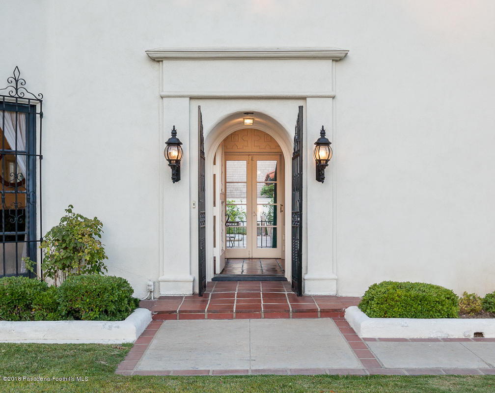 700 South Orange Grove Boulevard Pasadena, CA 91105 - Photo 3 of 50 a front view of a house with garden