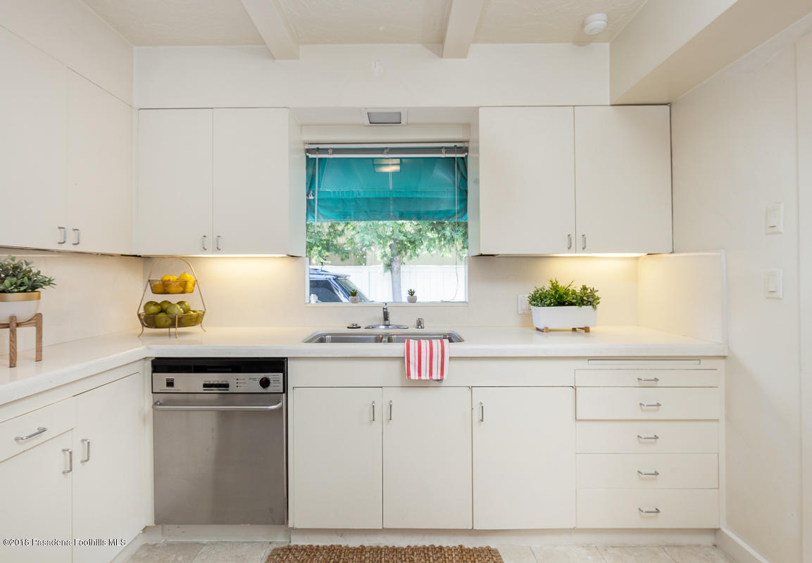 700 South Orange Grove Boulevard Pasadena, CA 91105 - Photo 26 of 50 a kitchen with granite countertop a sink stainless steel appliances and cabinets