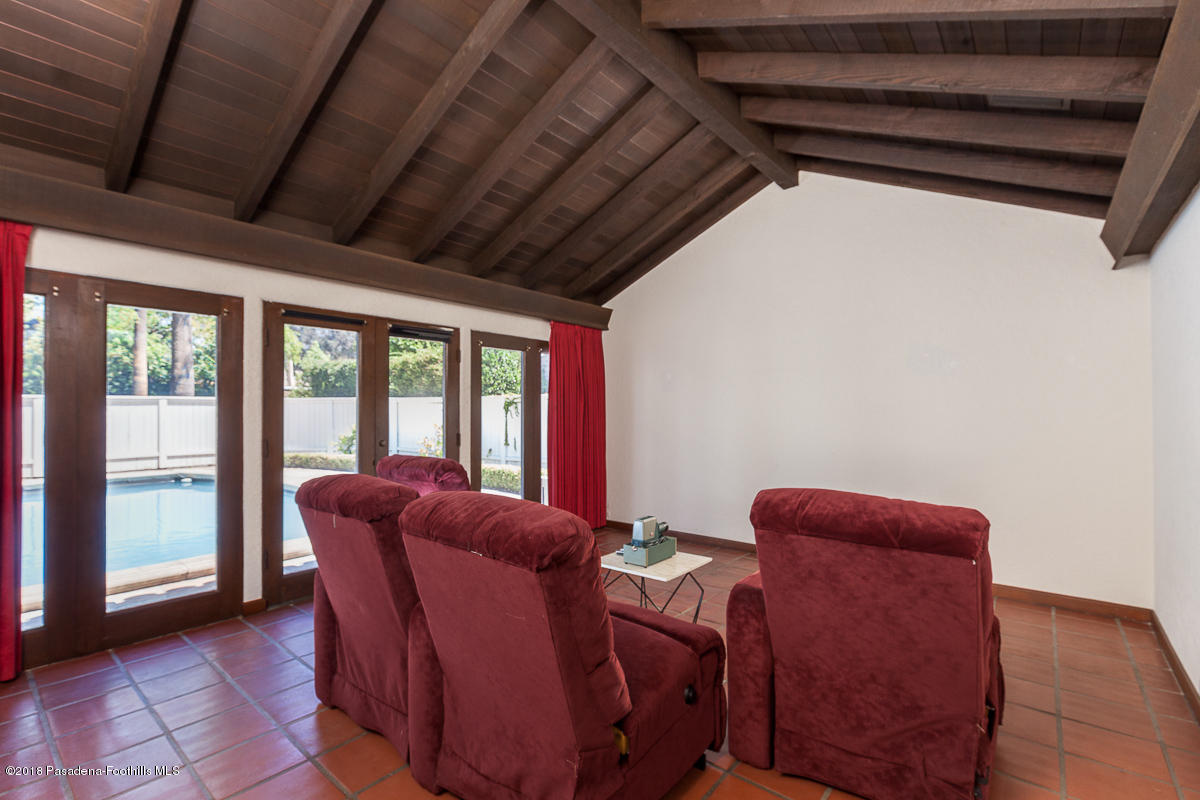 700 South Orange Grove Boulevard Pasadena, CA 91105 - Photo 30 of 50 a living room with furniture a ceiling fan and a window
