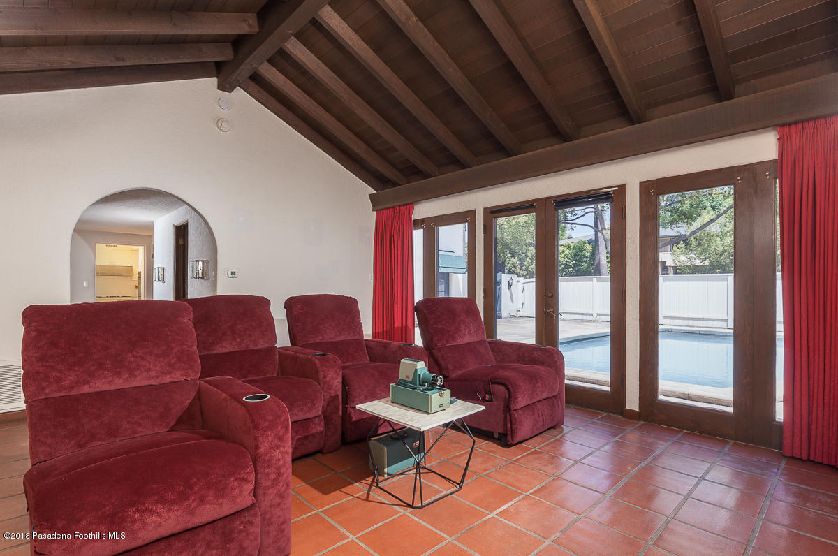 700 South Orange Grove Boulevard Pasadena, CA 91105 - Photo 31 of 50 a living room with furniture and large windows