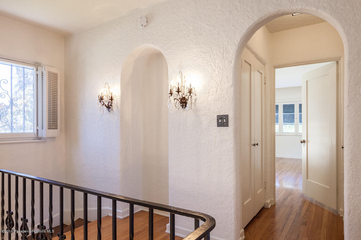 700 South Orange Grove Boulevard Pasadena, CA 91105 - Photo 36 of 50 a view of a livingroom from a hallway