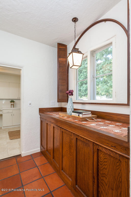 700 South Orange Grove Boulevard Pasadena, CA 91105 - Photo 39 of 50 a spacious bathroom with a granite countertop sink and a mirror
