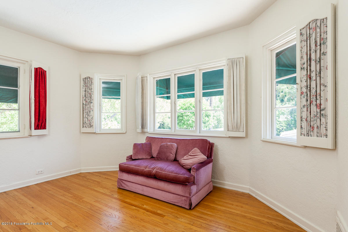 700 South Orange Grove Boulevard Pasadena, CA 91105 - Photo 42 of 50 a living room with furniture and a window