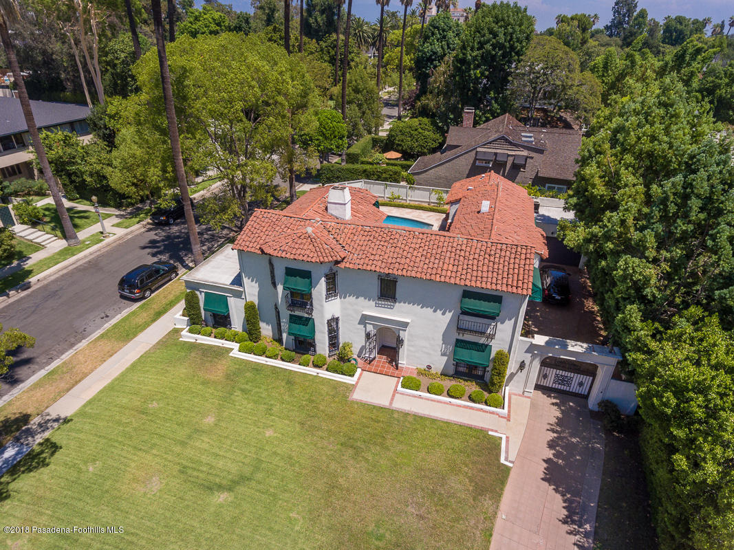 700 South Orange Grove Boulevard Pasadena, CA 91105 - Photo 48 of 50 an aerial view of a house with swimming pool and large trees