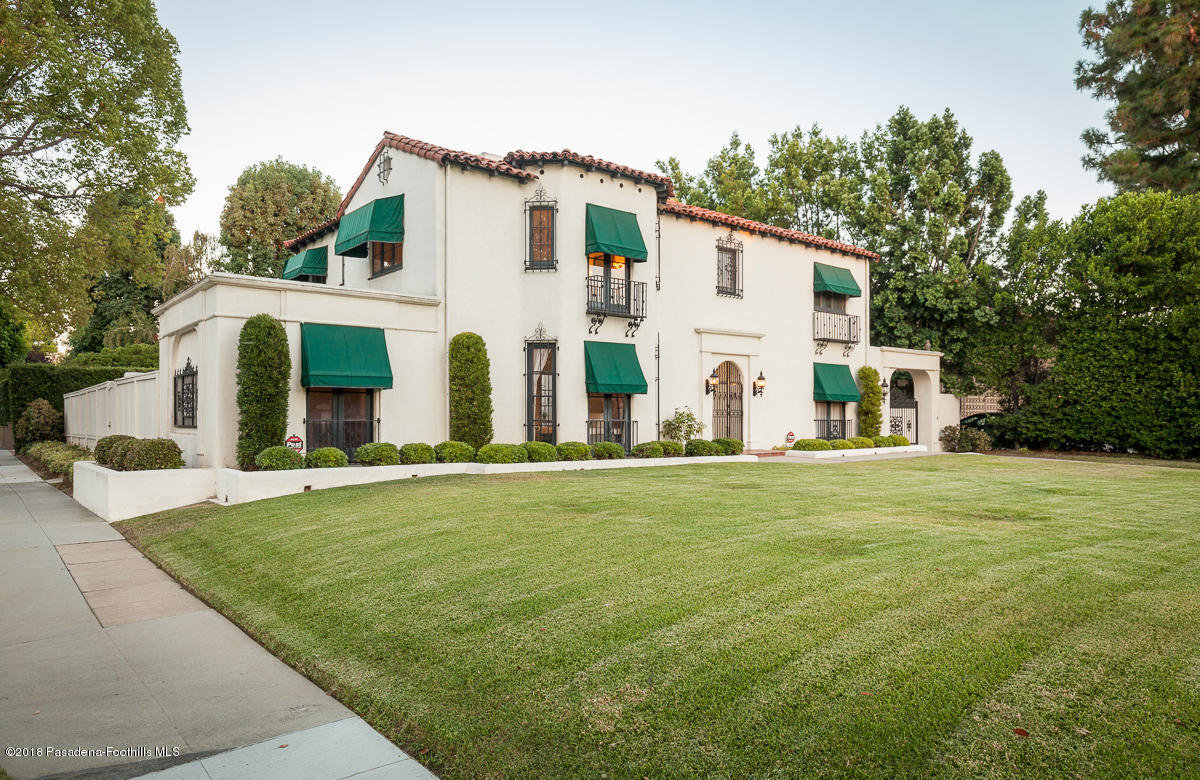 700 South Orange Grove Boulevard Pasadena, CA 91105 - Photo 50 of 50 a view of a white house with yard and furniture