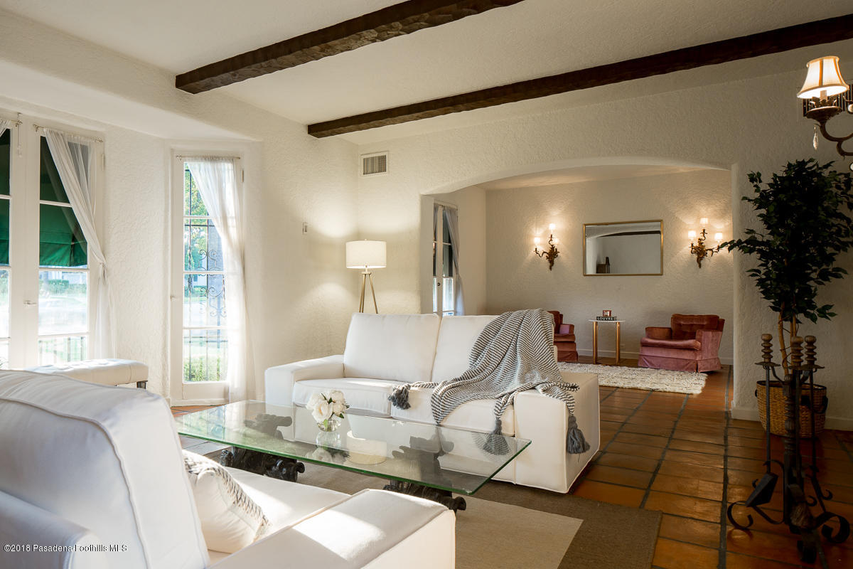 700 South Orange Grove Boulevard Pasadena, CA 91105 - Photo 7 of 50 a living room with furniture and a large window