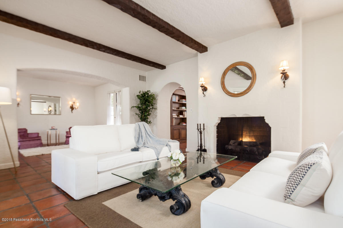 700 South Orange Grove Boulevard Pasadena, CA 91105 - Photo 8 of 50 a living room with furniture and a fireplace