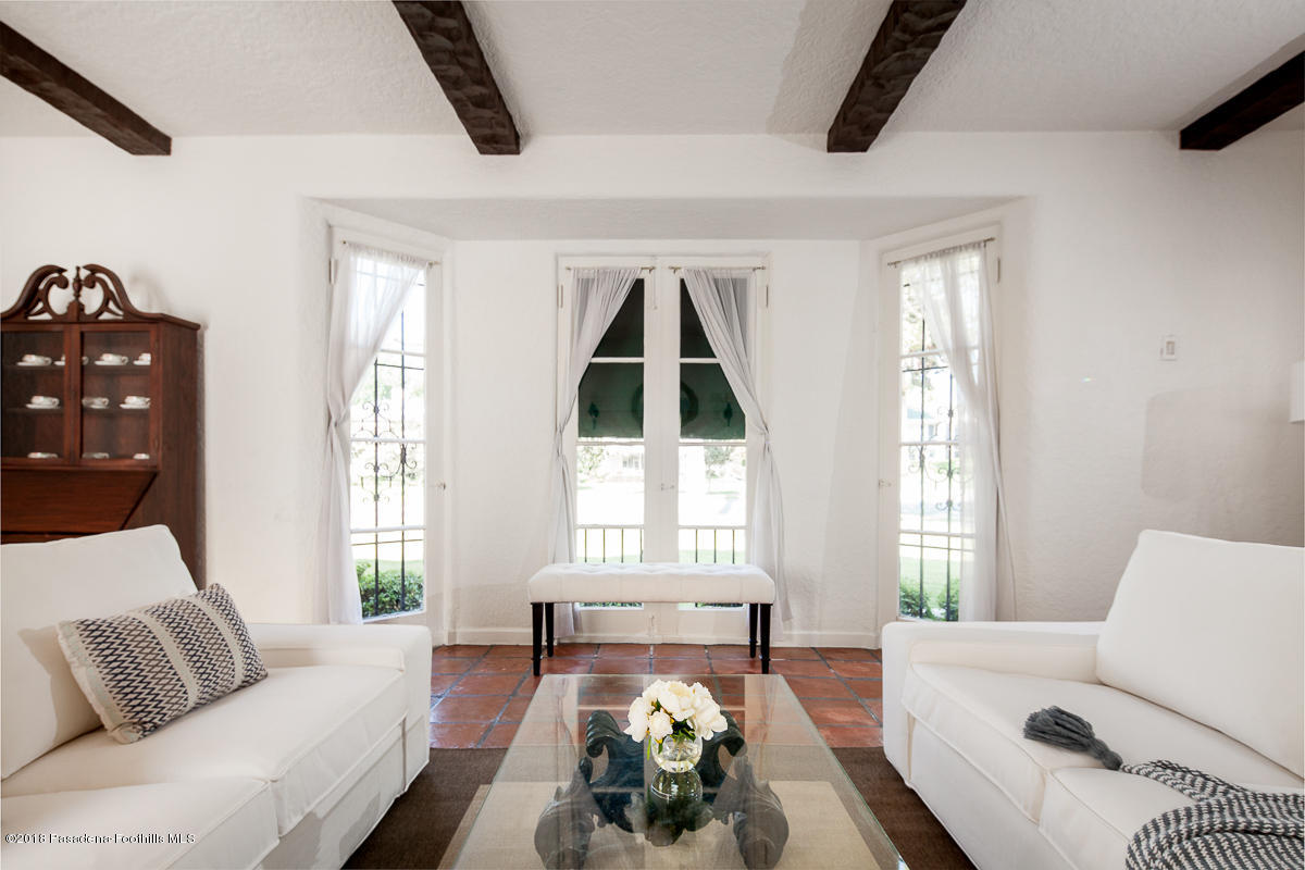 700 South Orange Grove Boulevard Pasadena, CA 91105 - Photo 9 of 50 a living room with furniture and a large window
