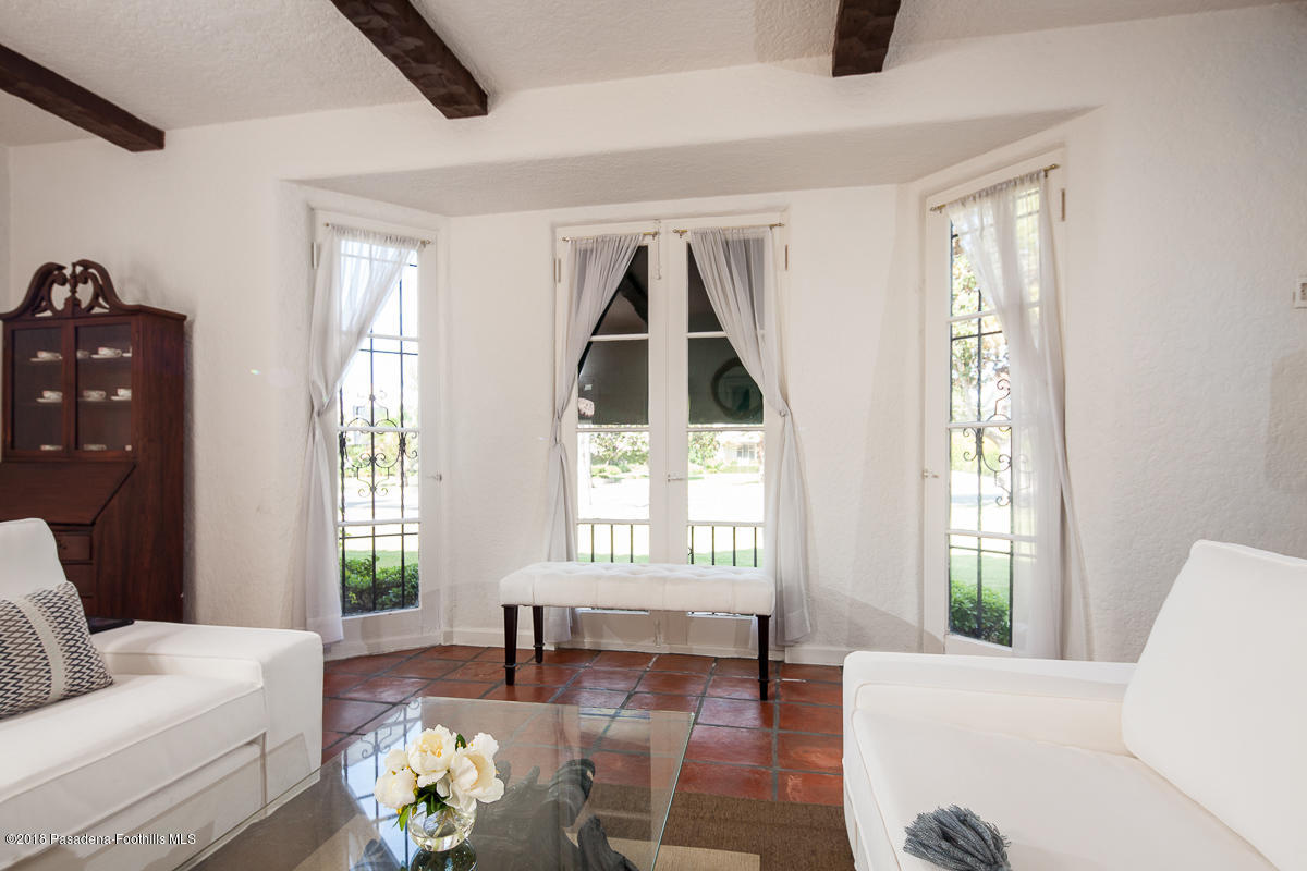 700 South Orange Grove Boulevard Pasadena, CA 91105 - Photo 10 of 50 a living room with furniture and a window