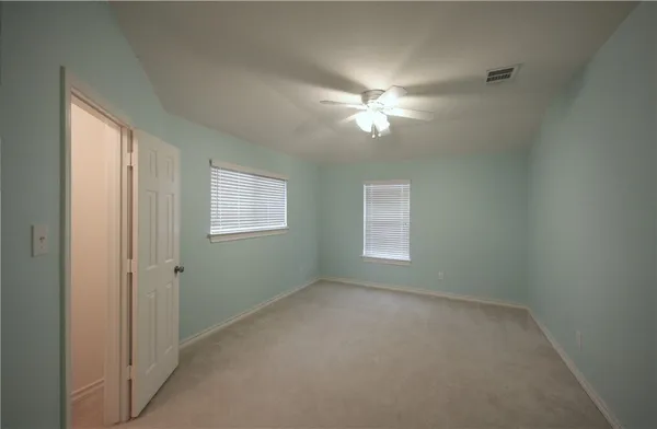 a view of empty room with windows