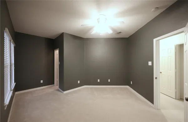 an empty room with a bathroom