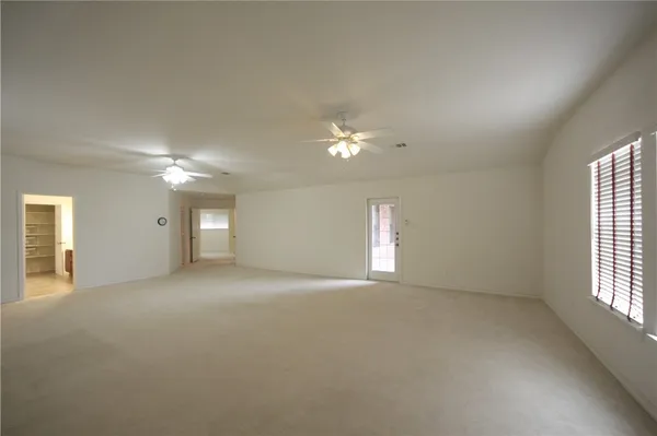 a view of hallway with a large window