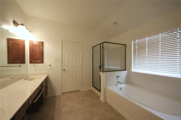 a bathroom with 2 sink and a mirror