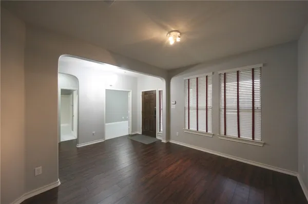 a view of livingroom with hardwood floor and hallway