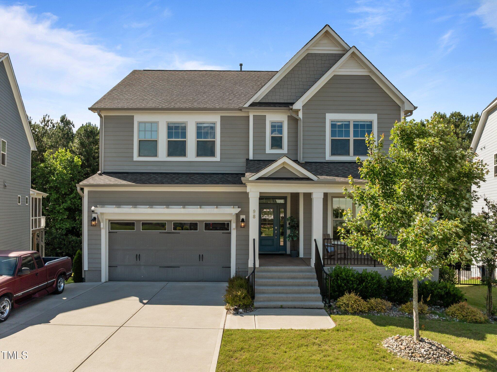 98 Stone Bridge Crossing Chapel Hill, NC 27517 - Photo 1 of 37 a front view of a house with a yard