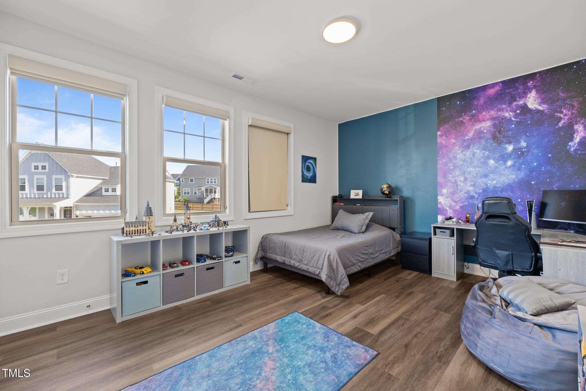 98 Stone Bridge Crossing Chapel Hill, NC 27517 - Photo 19 of 37 a bedroom with furniture and a large window