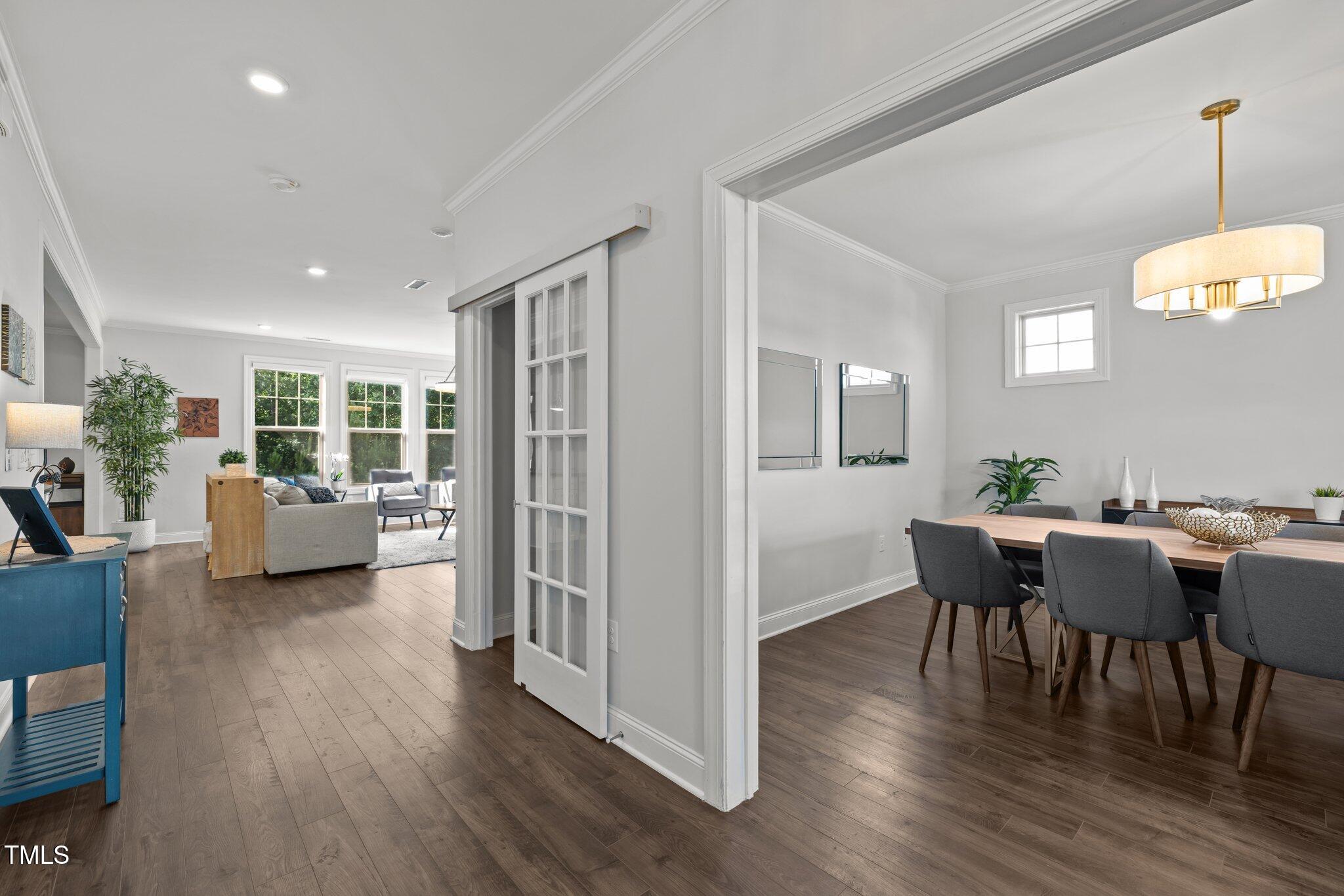 98 Stone Bridge Crossing Chapel Hill, NC 27517 - Photo 2 of 37 a view of a dining room with furniture window and wooden floor