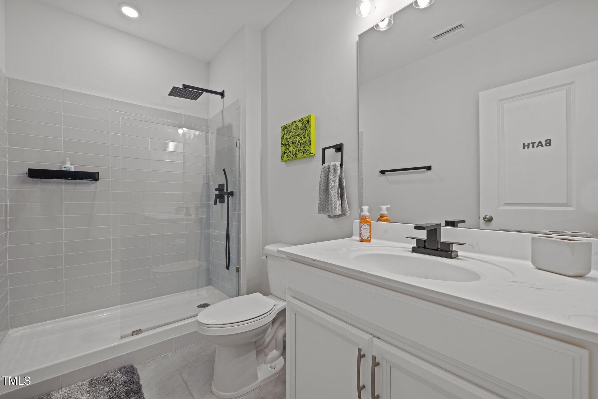 98 Stone Bridge Crossing Chapel Hill, NC 27517 - Photo 23 of 37 a bathroom with a sink a toilet and shower