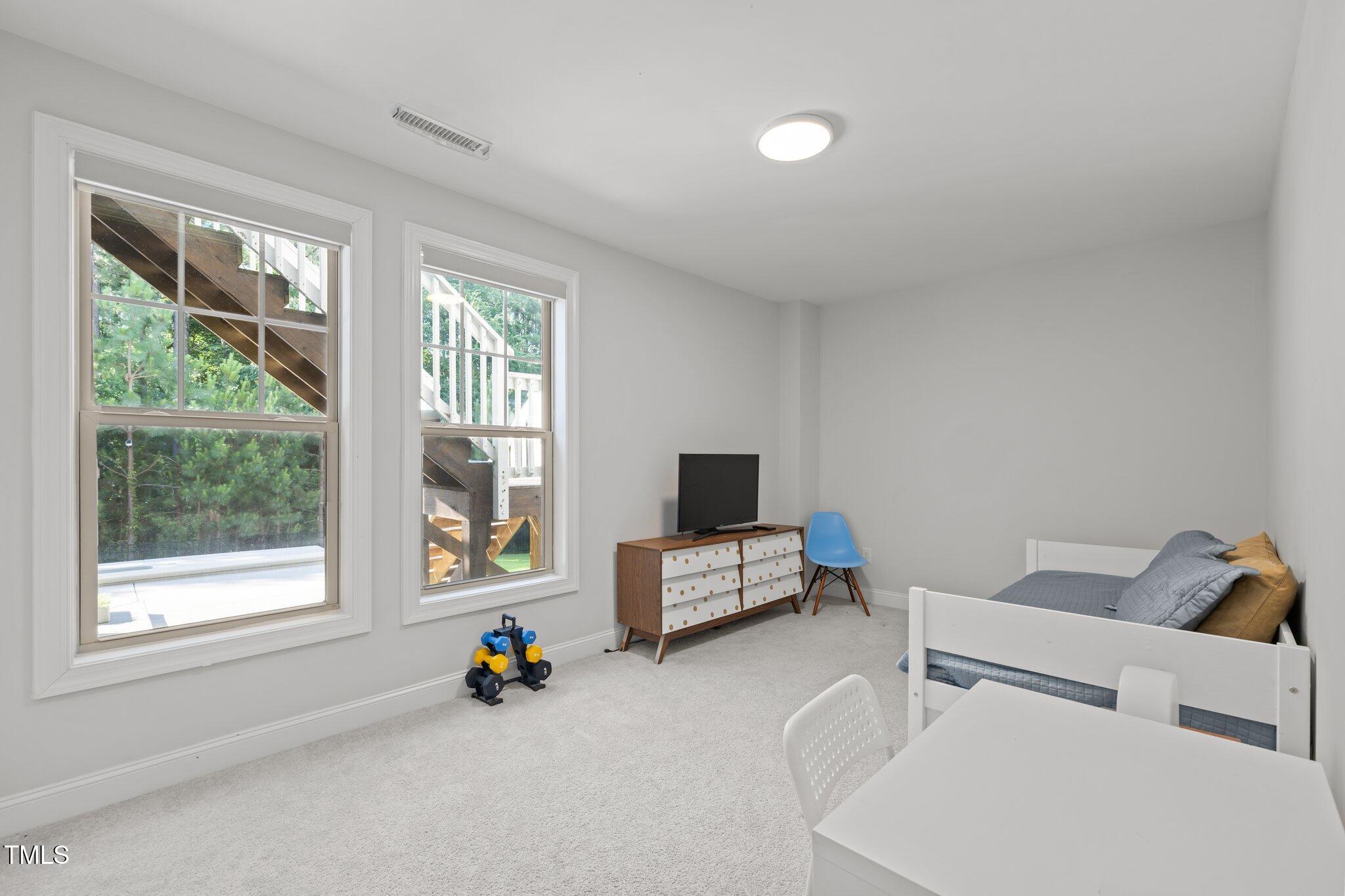 98 Stone Bridge Crossing Chapel Hill, NC 27517 - Photo 24 of 37 a living room with furniture and a window