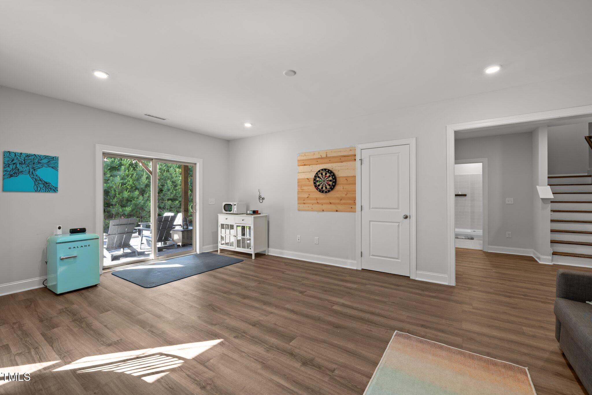 98 Stone Bridge Crossing Chapel Hill, NC 27517 - Photo 25 of 37 a living room with furniture window and wooden floor