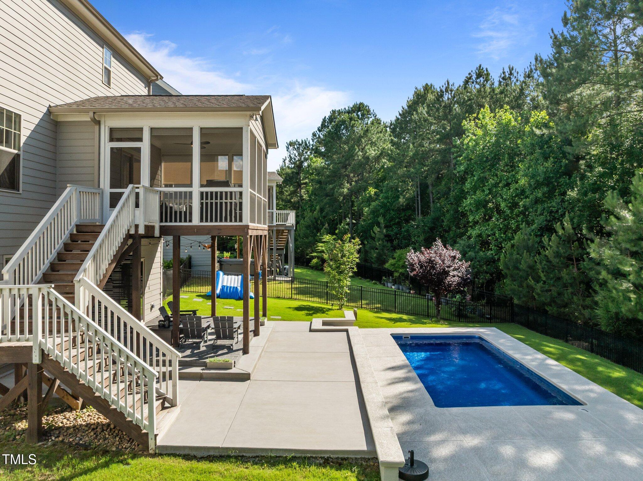 98 Stone Bridge Crossing Chapel Hill, NC 27517 - Photo 27 of 37 a view of a house with swimming pool and sitting area