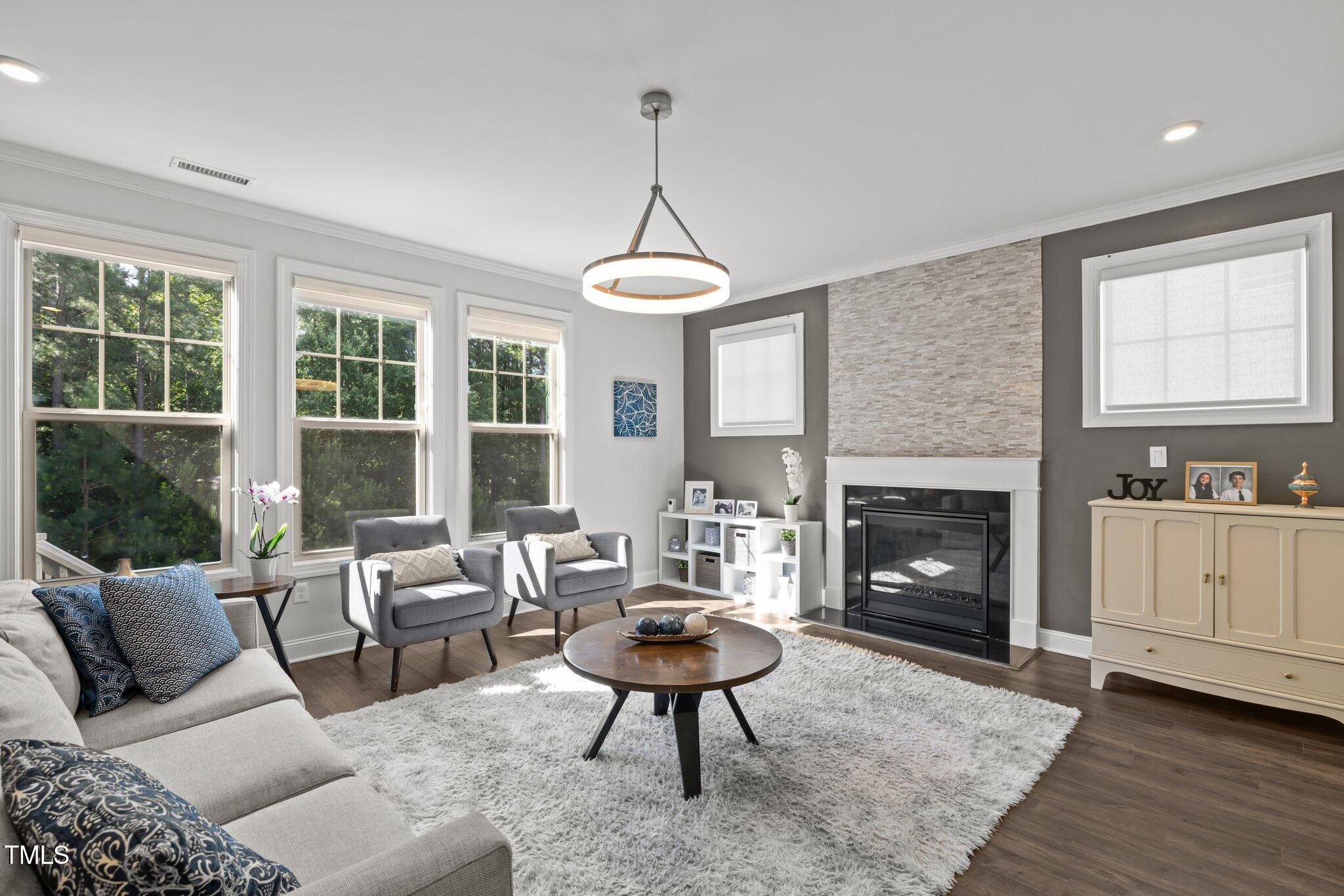 98 Stone Bridge Crossing Chapel Hill, NC 27517 - Photo 4 of 37 a living room with furniture and a fireplace