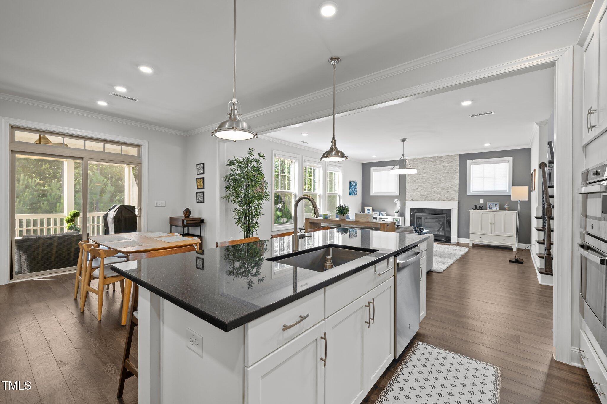 98 Stone Bridge Crossing Chapel Hill, NC 27517 - Photo 9 of 37 a kitchen with center island table and chairs