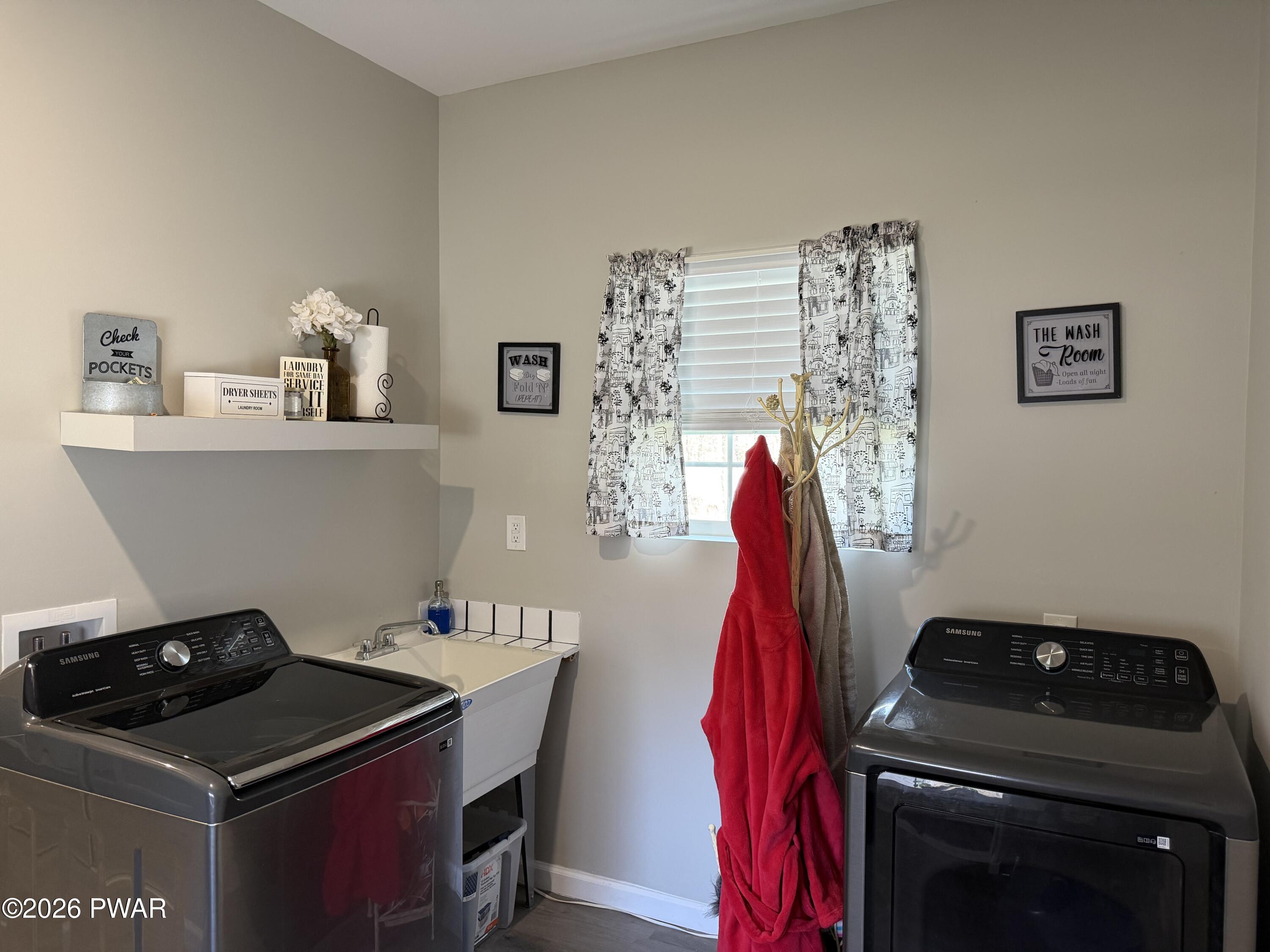 801 Maple Ridge Court Hawley, PA 18428 - Photo 44 of 55 a utility room with dryer and washer