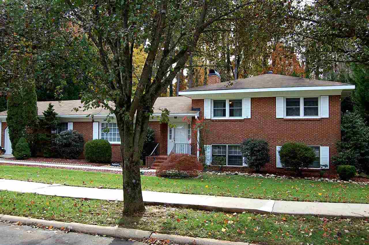 800 Purdue Street Raleigh, NC 27609 - Photo 1 of 21 a front view of a house with a yard and garage