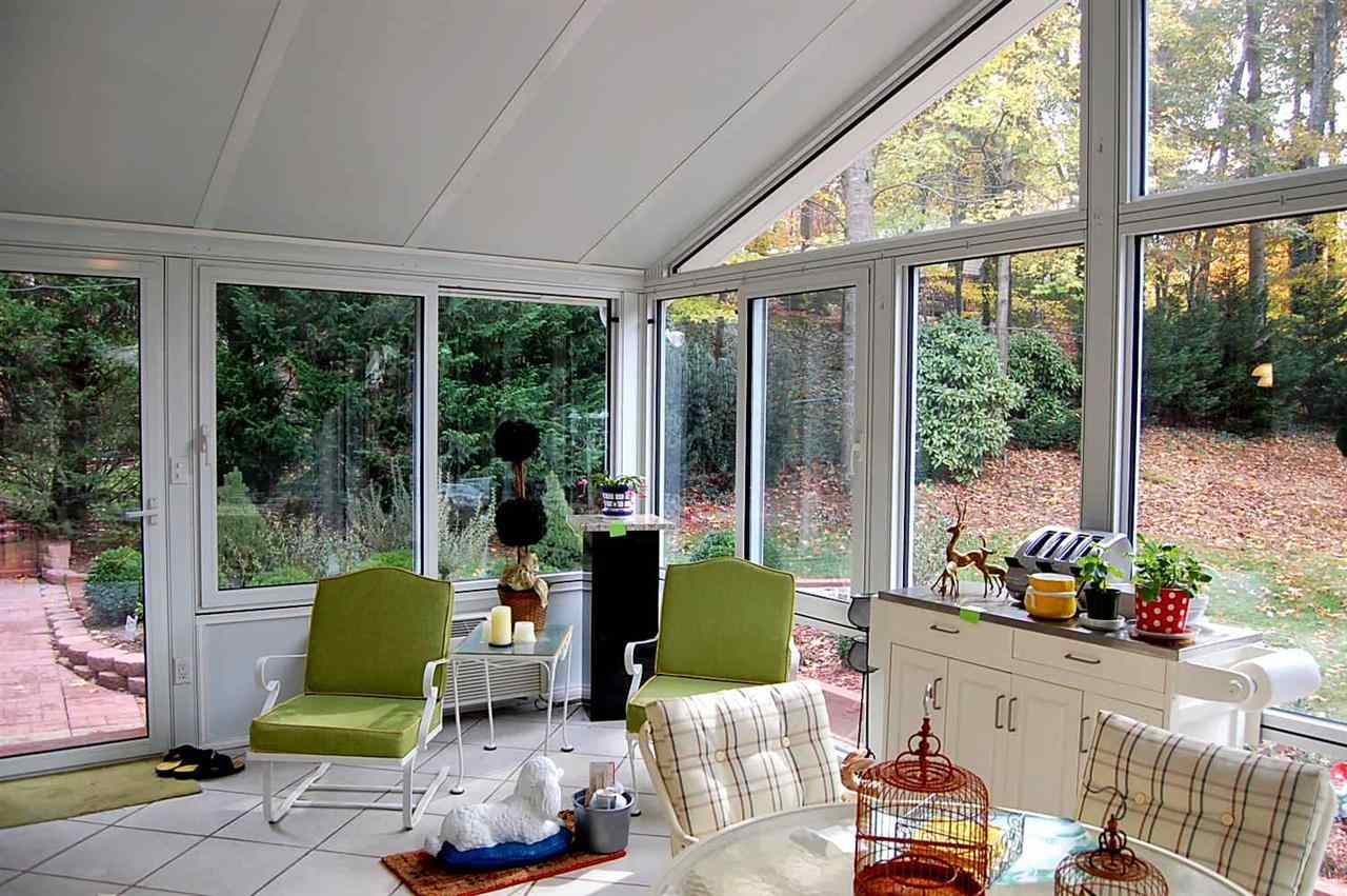 800 Purdue Street Raleigh, NC 27609 - Photo 11 of 21 a living room with furniture and floor to ceiling windows
