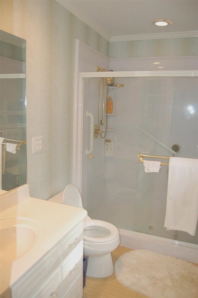 800 Purdue Street Raleigh, NC 27609 - Photo 13 of 21 a bathroom with a toilet and a shower