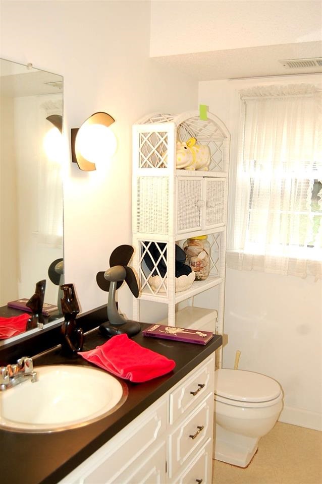 800 Purdue Street Raleigh, NC 27609 - Photo 18 of 21 a bathroom with a sink and a mirror